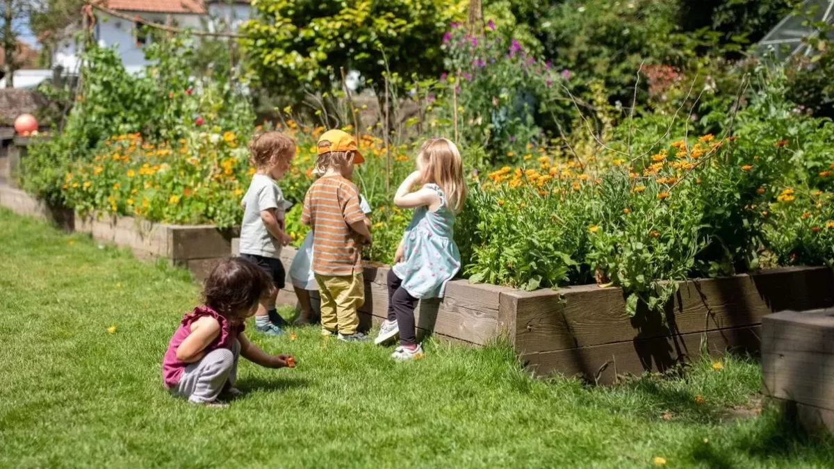 children in the gardening area of the nursery grounds