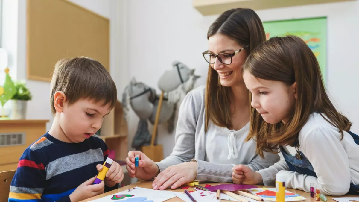 Preschool Teacher with Children at Kindergarten - Creative Art Class