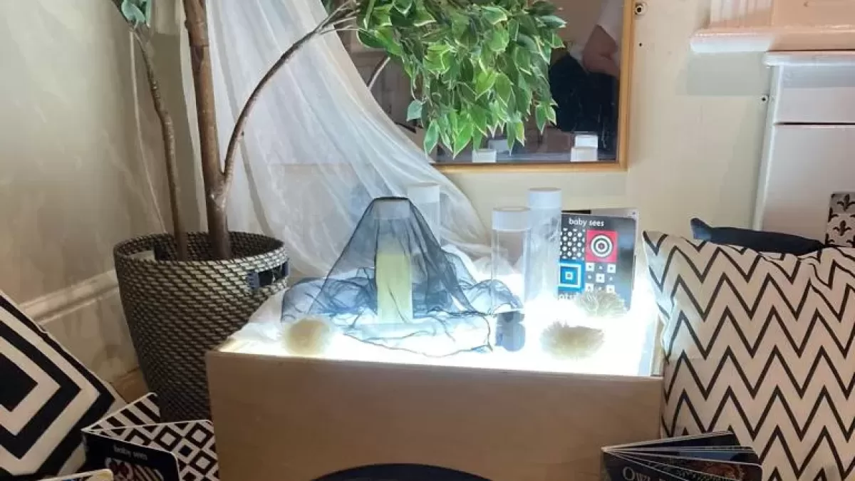 table lit up with books near it